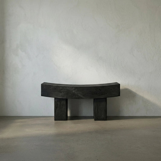 Bow Bench by Noir in burnt black. Made from munggur in a modern style.