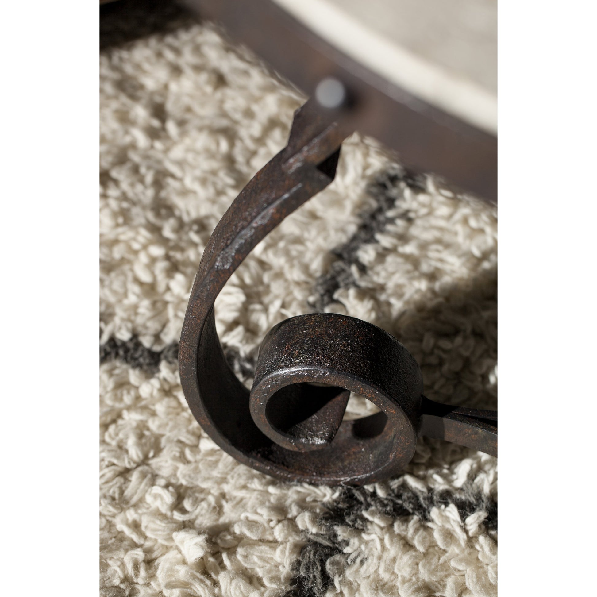 Luckenbach Metal & Stone End Table by Hooker Furniture in black. Made from cast iron, antique travertine in a traditional style.