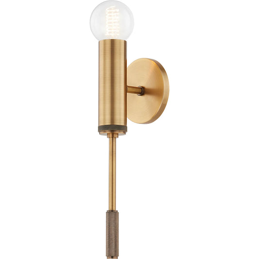 Chino Wall Sconce by Troy in patina brass. Made from steel in a modern style.