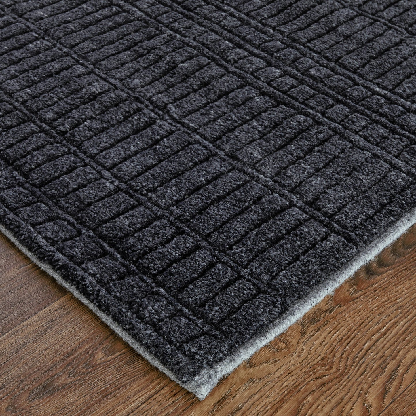 002 SI-2159065,SI-2159066,SI-2159067,SI-2159068,SI-2159071,SI-2159314 | Closeup | Vesper Transitional Solid Rug - T20T6036 by Thom Felicia by Feizy Rugs in black. Made from wool in a unique style.