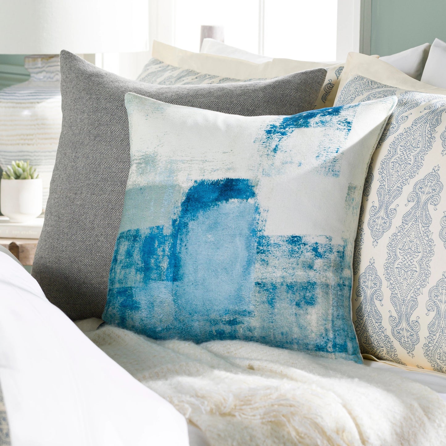 005 SI-1845117,SI-1845118,SR-879470,SR-879471 | Lifestyle | Balliano Pillow - 32055 by Livabliss in aqua, white, pale blue. Made from 100% polyester in a modern style.