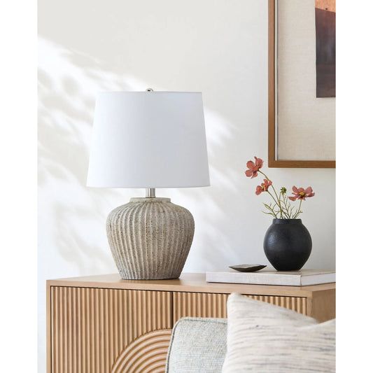 Bamba Accent Table Lamp by Livabliss in body: gray; shade: white; finial: metallic - gold; cord: translucent and hand painted. Made from ceramic, iron, linen, polyester in a modern style.