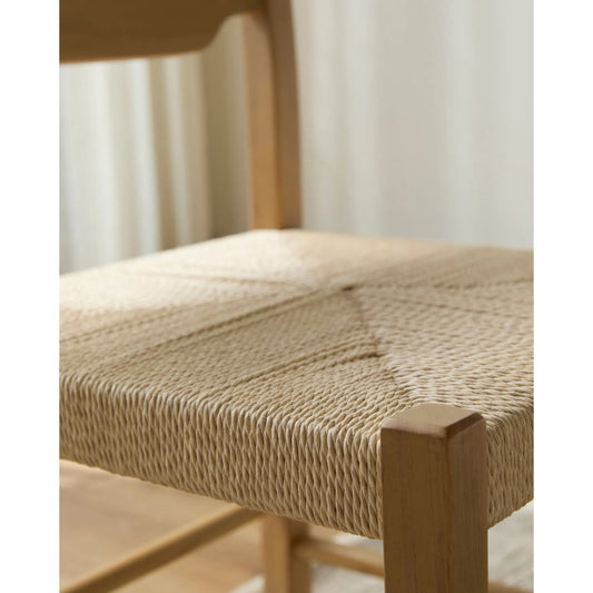 Arista Dining Chair (Set of 2) by Becki Owens x Livabliss in top: tan, white; base: tan and stained, matte. Made from ash wood veneer, cotton cord, rope, rubber wood in a rustic style.