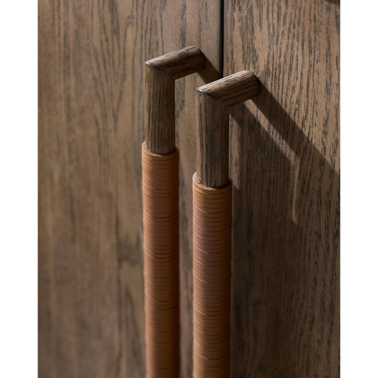 Atra Sideboard by Becki Owens x Surya in brown and stained. Made from rubber wood, oak veneer, leather wrapped in a traditional style.