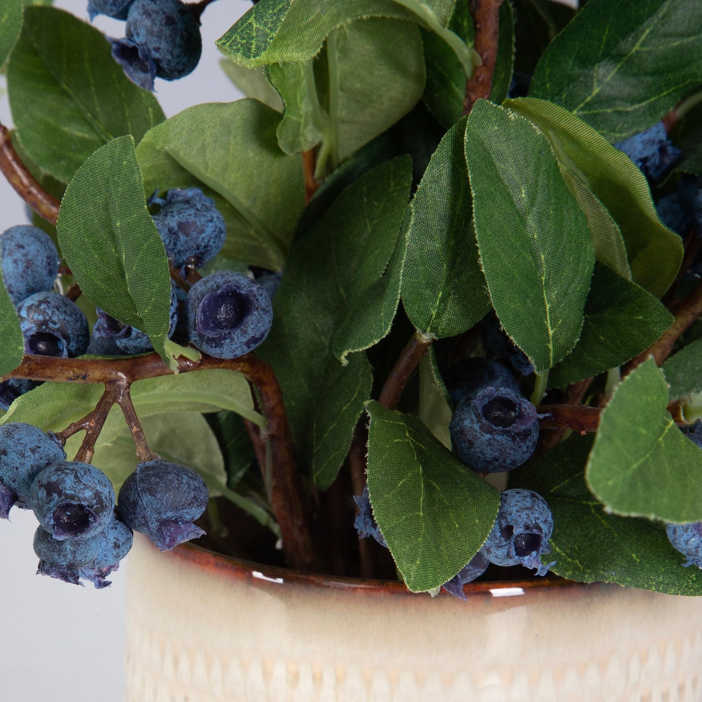 004 SI-2146907 | Closeup | Blueberry Fields Accent by Uttermost in tan. Made from polyester, plastic, ceramic, glue, iron in a modern style.