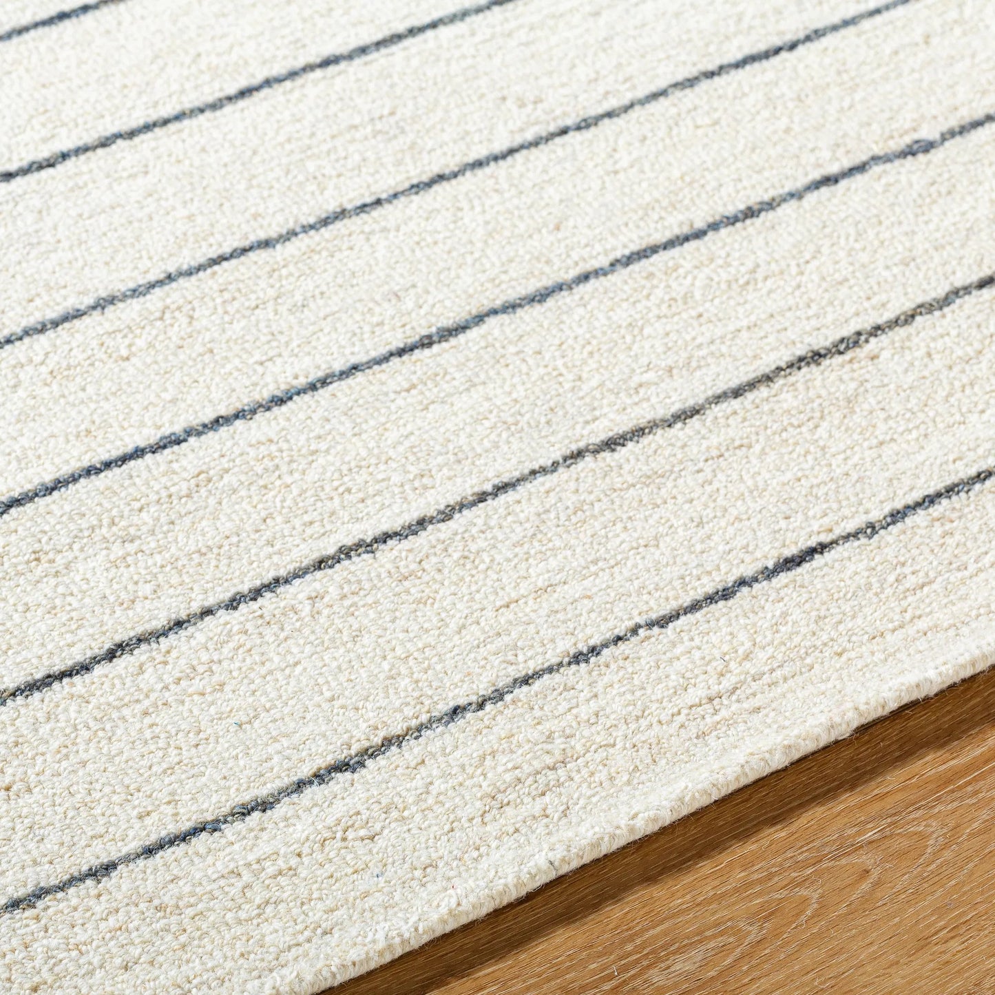 005 SI-2168072,SI-2168073,SI-2168074 | Closeup | Bournemouth Rug - 531064 by Livabliss in off-white. Made from wool in a unique style.