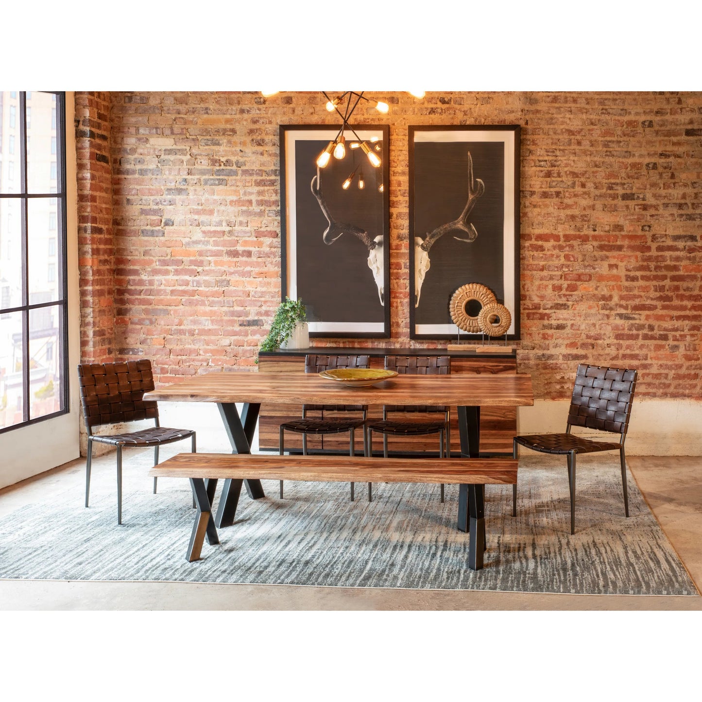 005 SI-2242835 | Lifestyle | Elliston 80" Dining Table by World Interiors in brown, black and natural. Made from reclaimed iron sheesham wood in a transitional style.