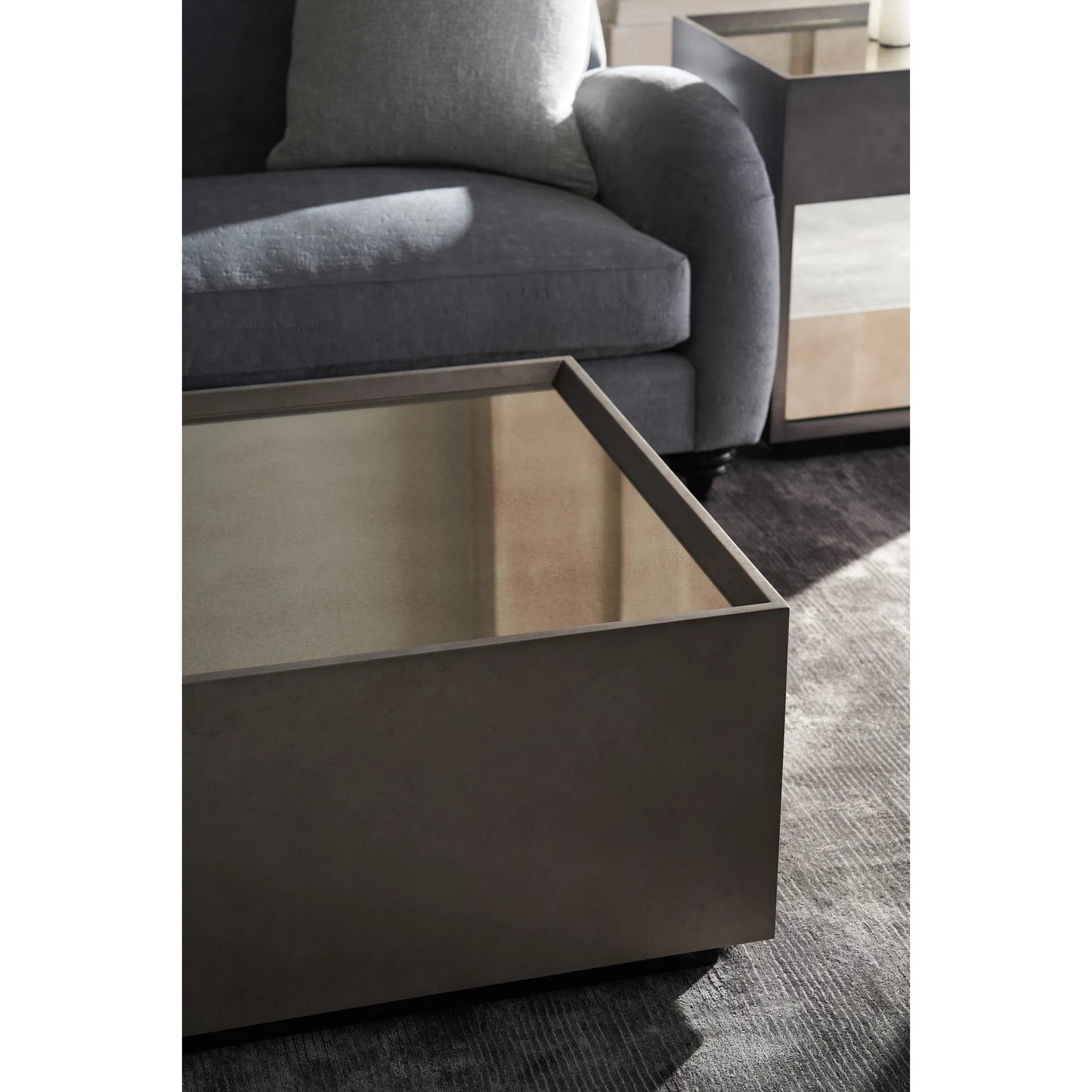 005 SI-2162893 | Lifestyle | Dark Matter Cocktail Table by Caracole in mirrored, black and twilight frost, almost black. Made from poplar, mirror in a transitional style.