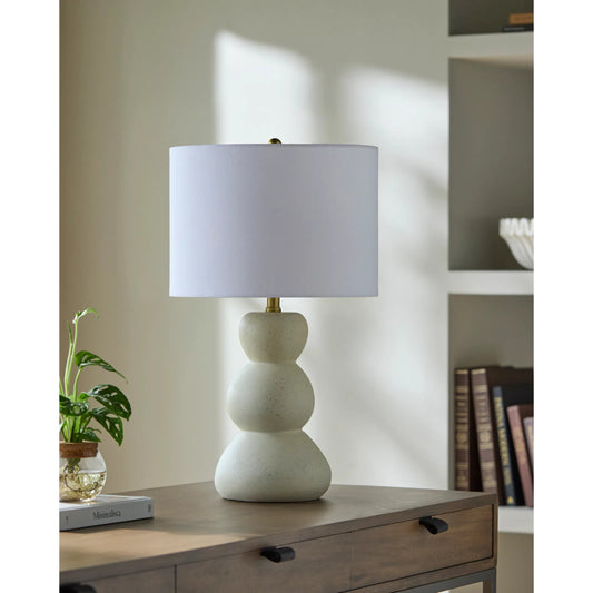 Cayey Accent Table Lamp by Livabliss in body: cream; shade: white; finial: metallic - brass; harp: metallic - brass; cord: translucent and paintedplated. Made from resin, linen, polyester, steel in a transitional style.