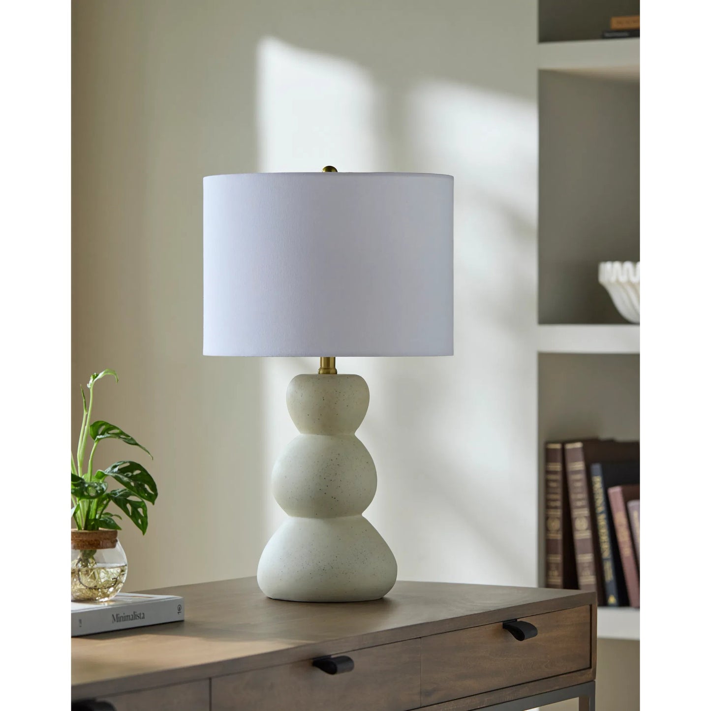 002 SI-2246064 | Lifestyle | Cayey Accent Table Lamp by Livabliss in body: cream; shade: white; finial: metallic - brass; harp: metallic - brass; cord: translucent and paintedplated. Made from resin, linen, polyester, steel in a transitional style.