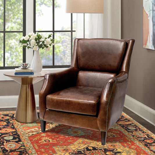 Vicenza Wing Chair by Pasargad Home in brown. Made from leather in a rustic style.
