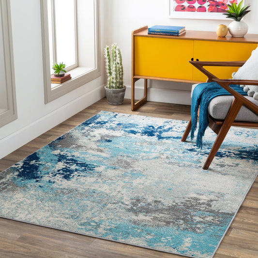 Chester Rug by Livabliss in dark blue, aqua, off-white, gray, charcoal. Made from 100% polypropylene in a modern style.