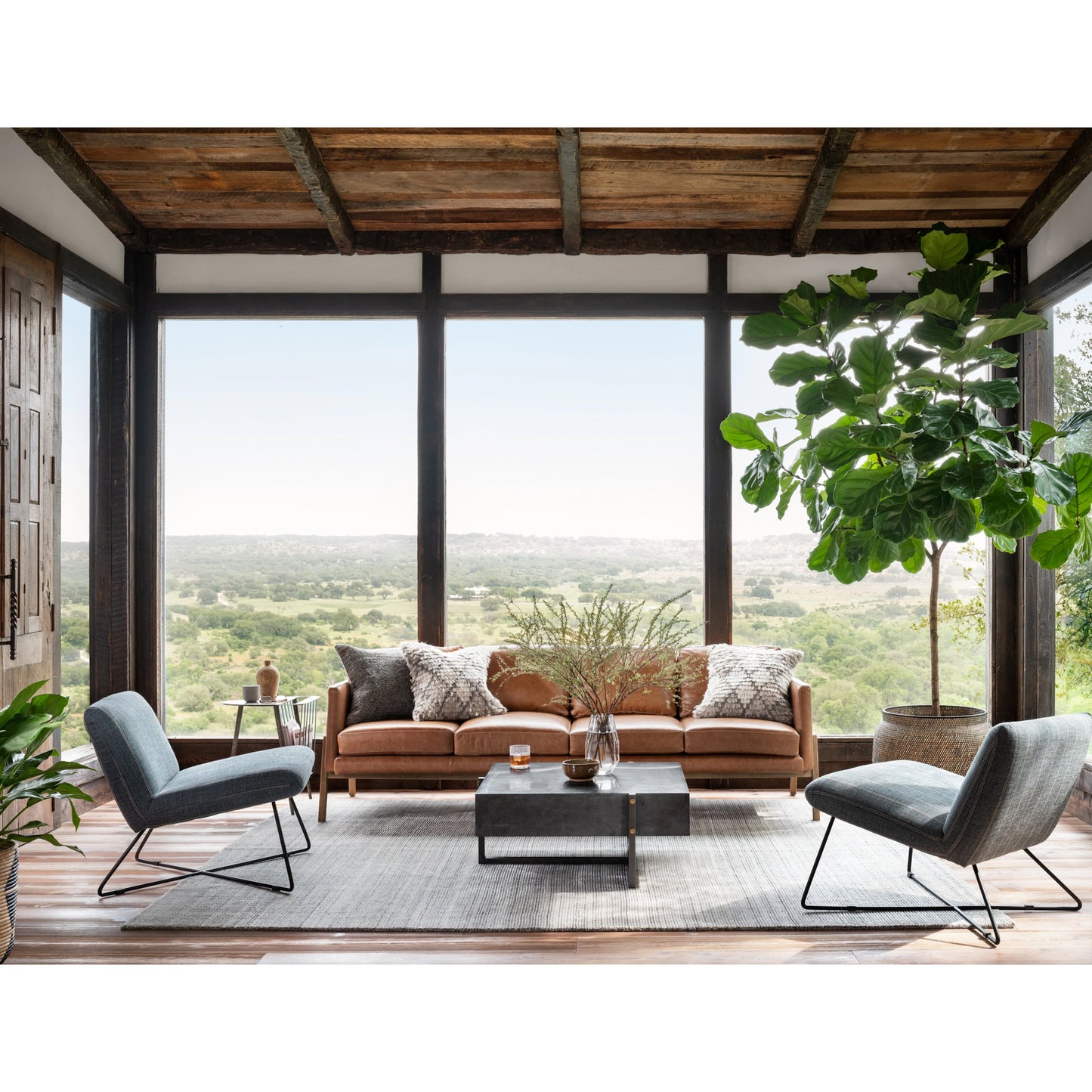 016 SI-1715804 | Lifestyle | Keppler Square Coffee Table by Four Hands in light rustic black, bluestone and light rustic black, blue stone. Made from bluestone, iron, hd metal in a modern style.