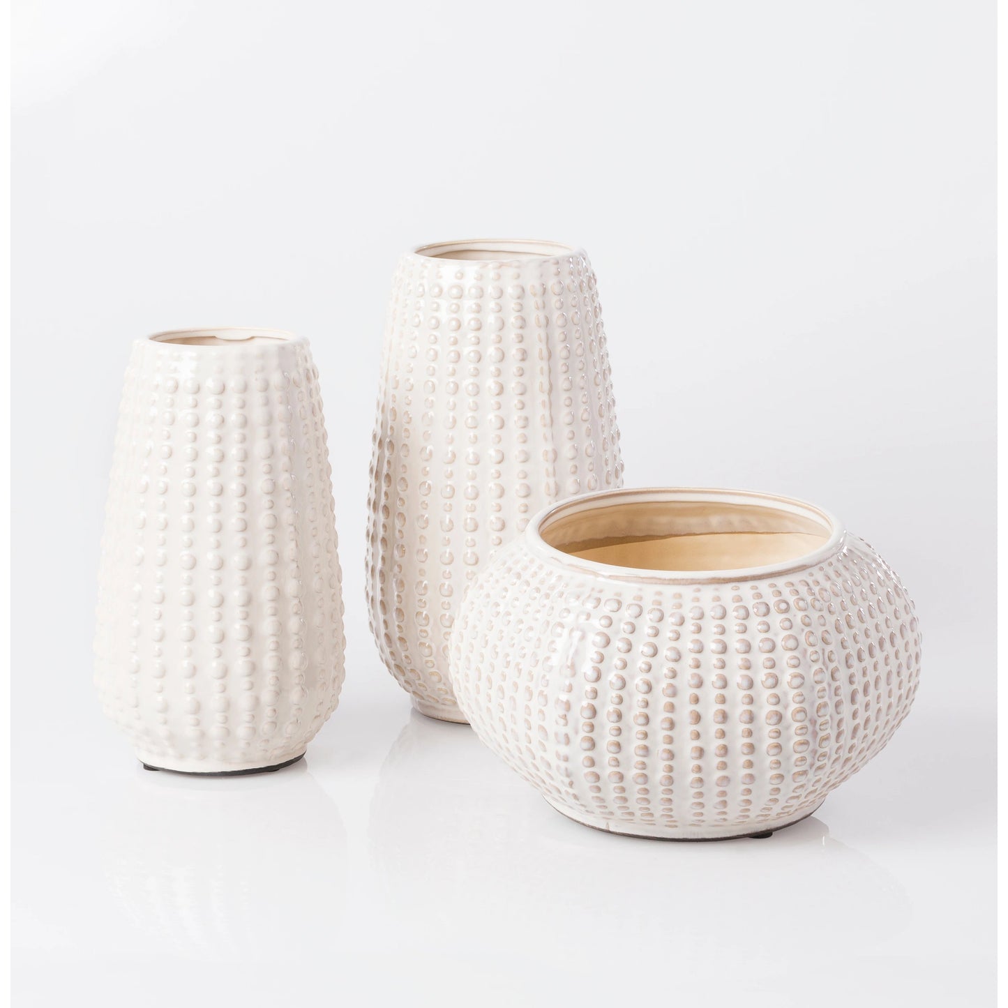 004 O-SURYA-CRW405-M,O-SURYA-CRW405-S | Lifestyle | Clearwater - 14253 by Livabliss in ivory, light gray and glazed. Made from 100% ceramic in a coastal style.