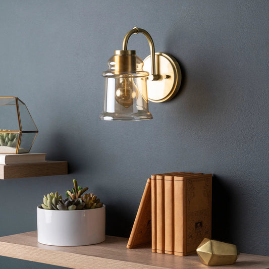 Crosley Wall Sconce - 25324 by Surya in metallic brass, clear, champagne and polished brass. Made from glass, metal in a modern style.