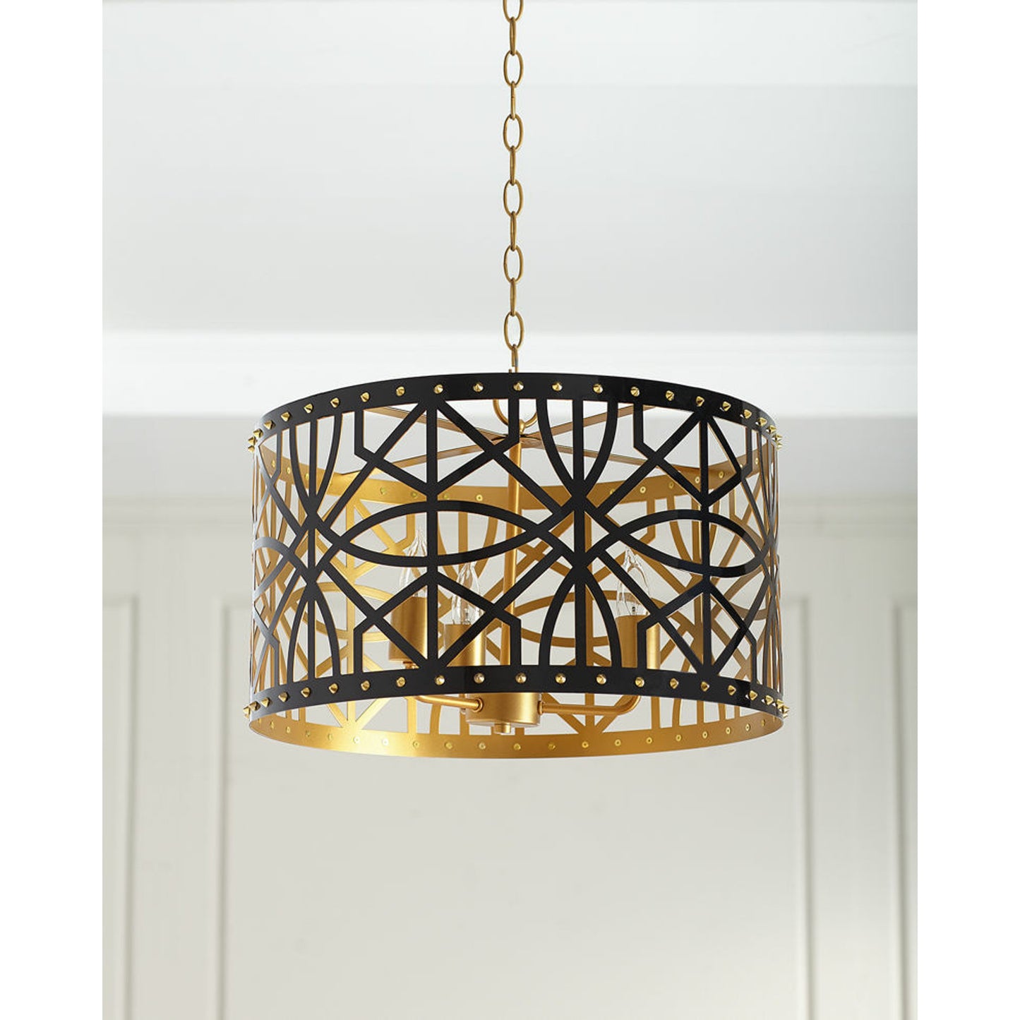001 SR-902070 | Primary Silo | Jonah Pendant by Couture Lamps in onyx black, gold nailheads. Made from metal in a transitional style.