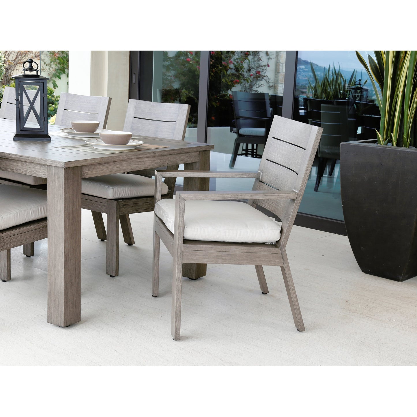 005 SI-2166967 | Lifestyle | Laguna Outdoor 90" Table by Sunset West in driftwood. Made from aluminum in a modern style.