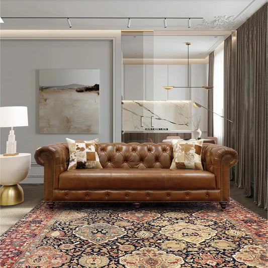 Paris Club Chesterfield Sofa by Pasargad Home in brown. Made from top grain vintage cigar finish leather in a transitional style.
