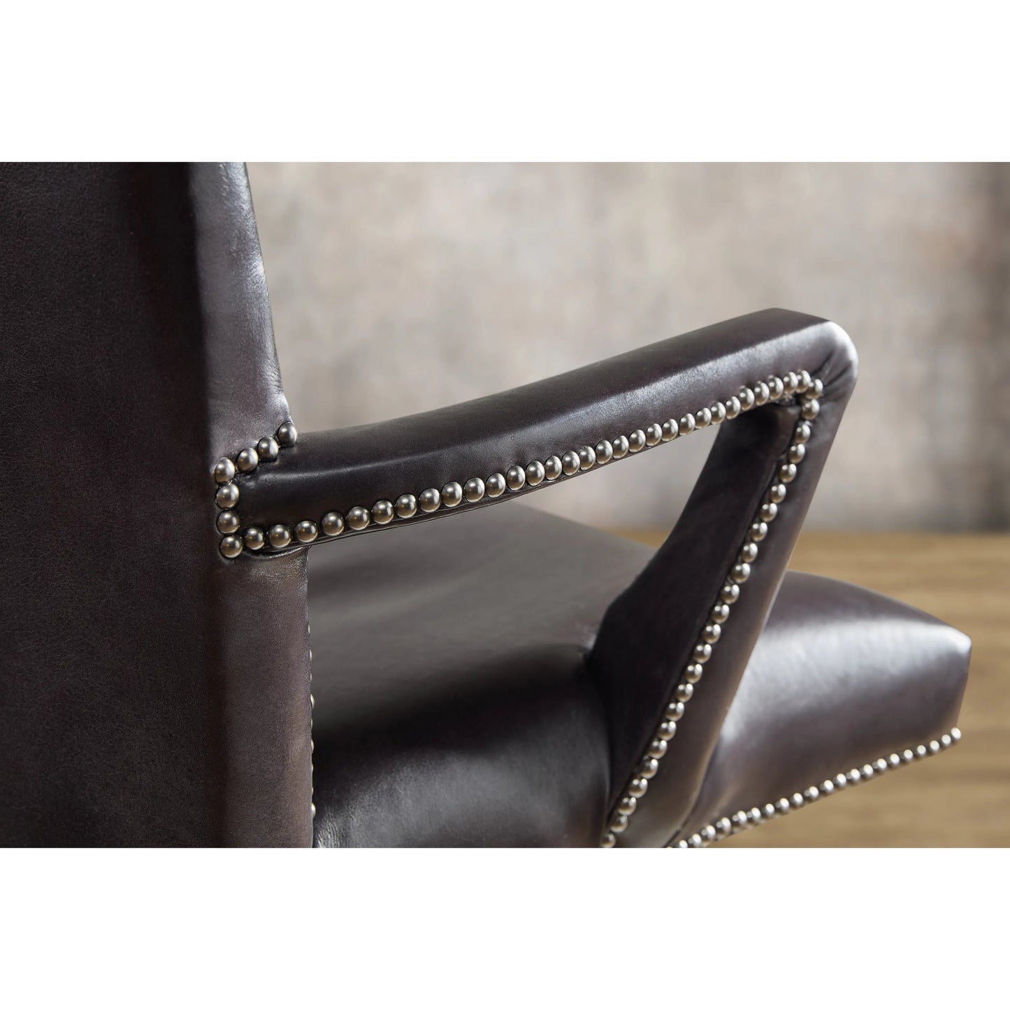 003 SI-2354031 | Closeup | Phoenix Executive Swivel Tilt Chair by Hooker Furniture in graphite. Made from leather in a unique style.