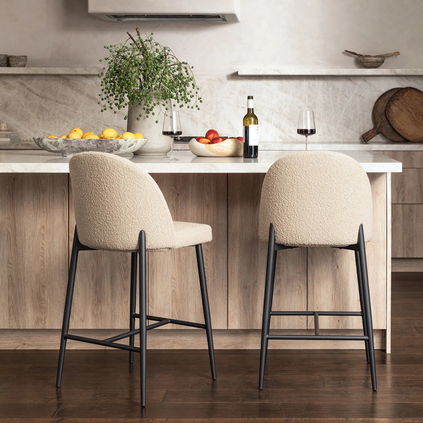 006 SI-2350545 | Lifestyle | Kristyn Counter Stool by Arch & Plane in sand, black. Made from boucle upholstery, metal in a modern style.