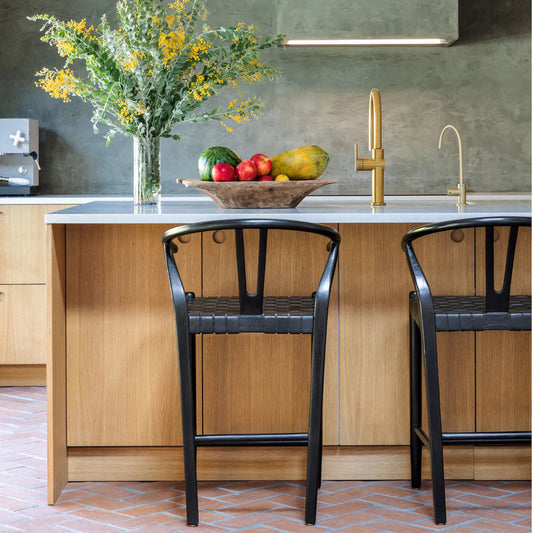 Bernice Counter Stool by Arch & Plane in antique black. Made from teak wood frame with full grain leather weave in a modern style.