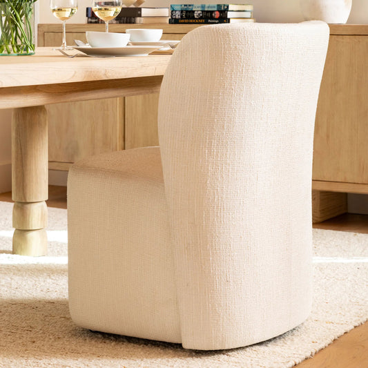 Saoirse Dining Chair by Arch & Plane in field cream. Made from tweed farbric in a transitional style.
