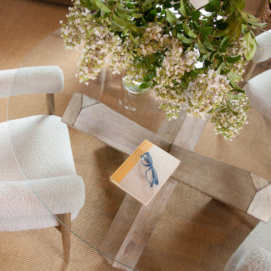 Kandice Glass Top Dining Table with Reclaimed Pedestal Base by Arch & Plane in light brown, clear and light brown. Made from reclaimed pine in a modern style.