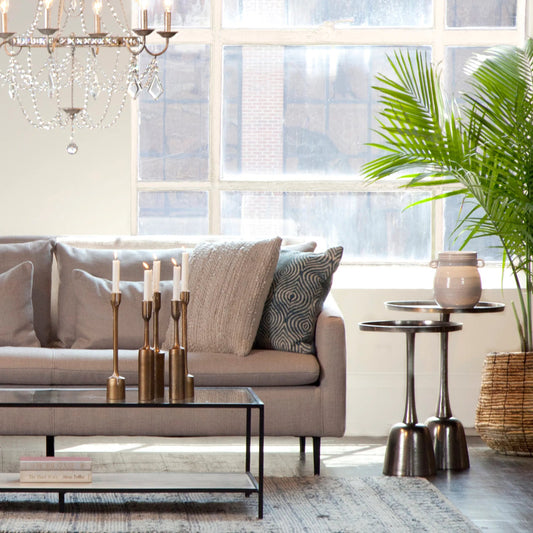 Wolvar Side Table by Arch & Plane in raw nickel with black patina finish. Made from cast aluminum in a modern style.