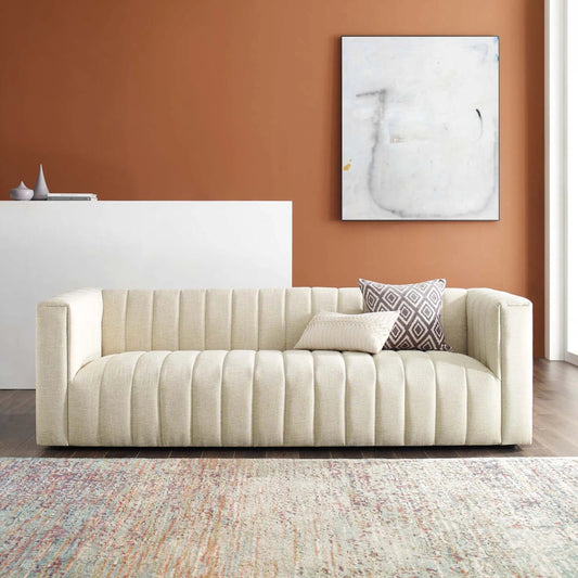 Levy Channel Sofa by Evans & Londeen in beige. Made from back cushion foam density, yuhua fabric, 100% polyester lhy light grey, murphy charcoal, black plastic legs, spring pocket inside the seat cushion in a modern style.