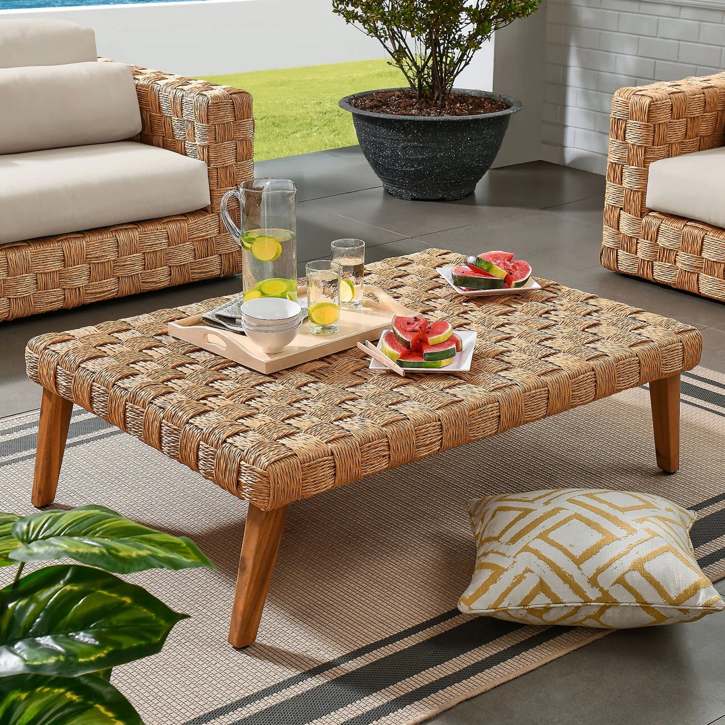 008 SI-2357958 | Lifestyle | Volusia Rattan Coffee Table by Evans & Londeen in natural. Made from rattan in a rustic style.