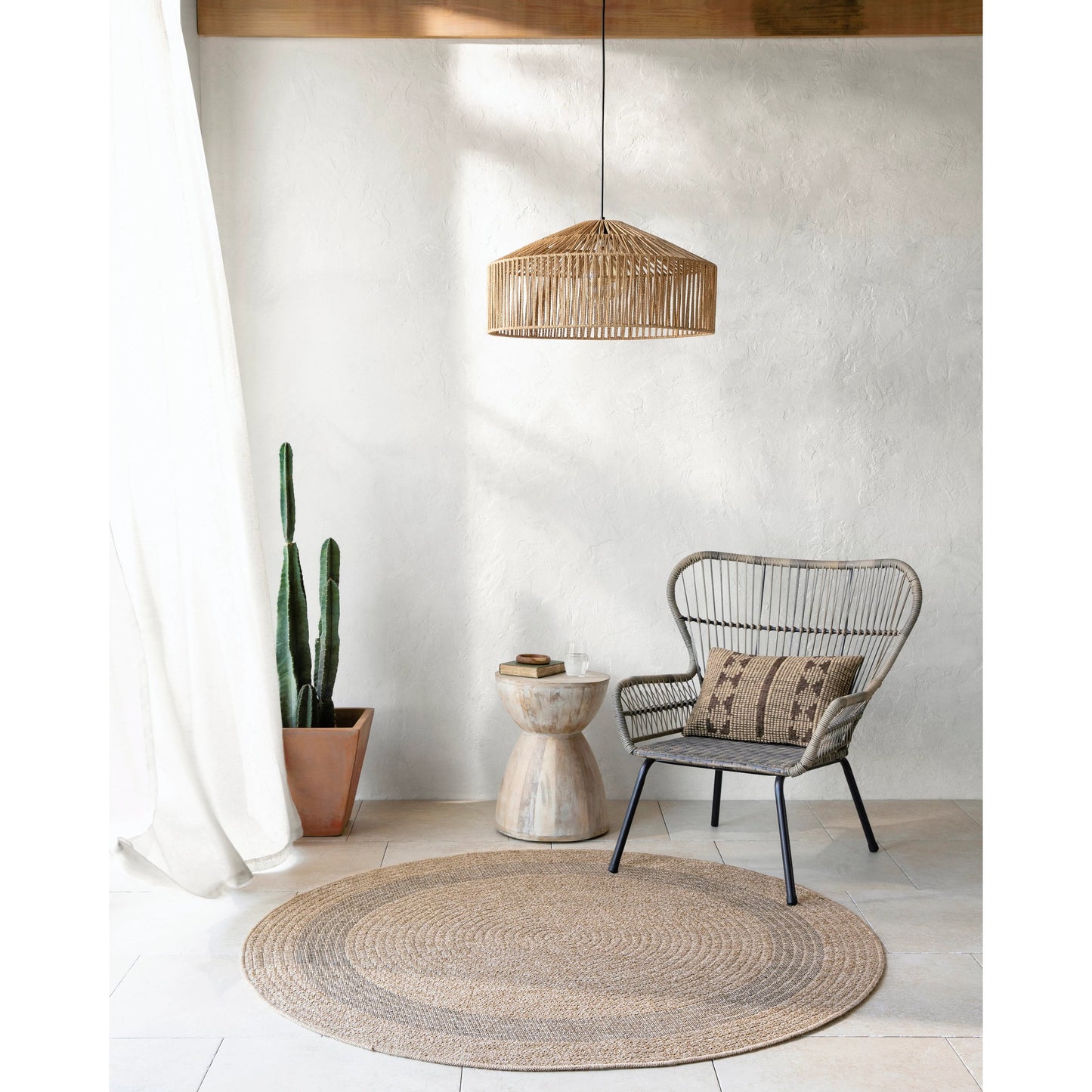 003 SI-1922163,SI-1922165 | Lifestyle | Encore ENC-2301 Indoor/Outdoor Rug by Livabliss in tan, black. Made from 100% polypropylene in a unique style.