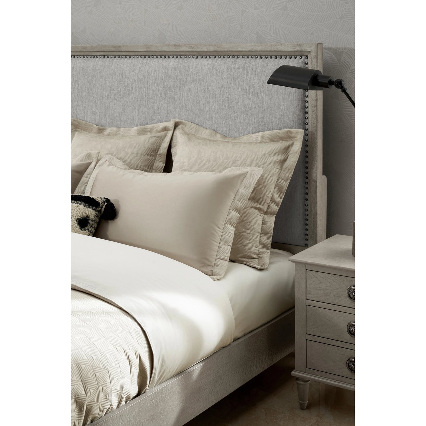 004 SI-2130655,SI-2130656 | Closeup | Zest Upholstered Bed with Nailhead Trim by Zest in greige. Made from rubberwood, oak veneer, fabric in a modern style.