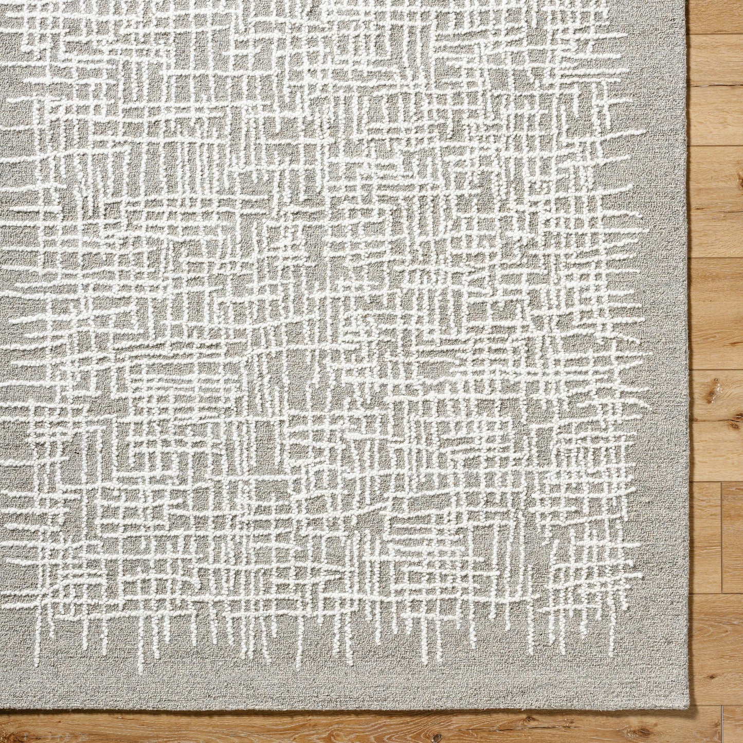 006 SI-2164719,SI-2164720,SI-2164721 | Closeup | Falcao Rug - 530951 by Livabliss in light silver, sterling grey, silver, ash, metallic - silver. Made from wool in a unique style.