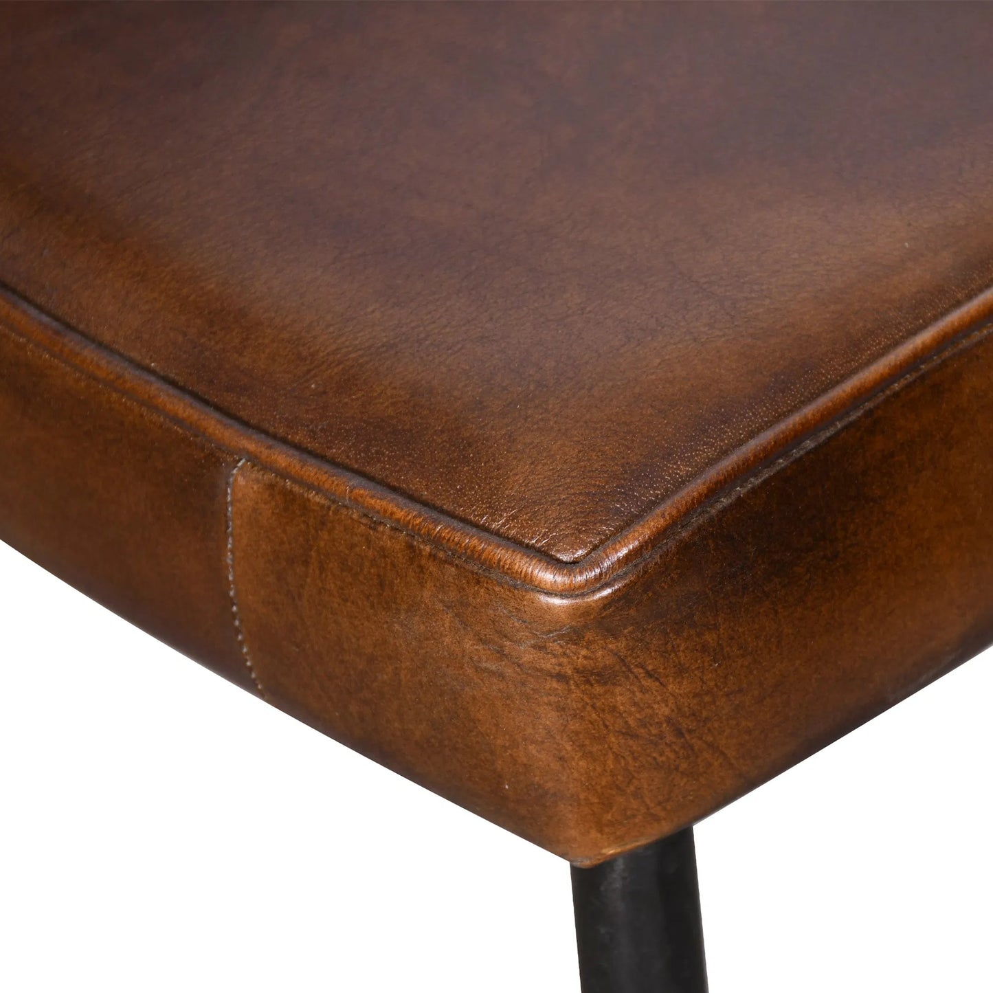 006 SI-2242774 | Closeup | Brisbane Leather Armchair by World Interiors in browns and hand washed. Made from reclaimed iron top, top grain leather in a traditional style.