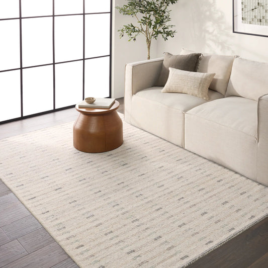 Finnigan FGN01 Rug by Jaipur Living in ivory, taupe, gray. Made from 100% wool in a unique style.