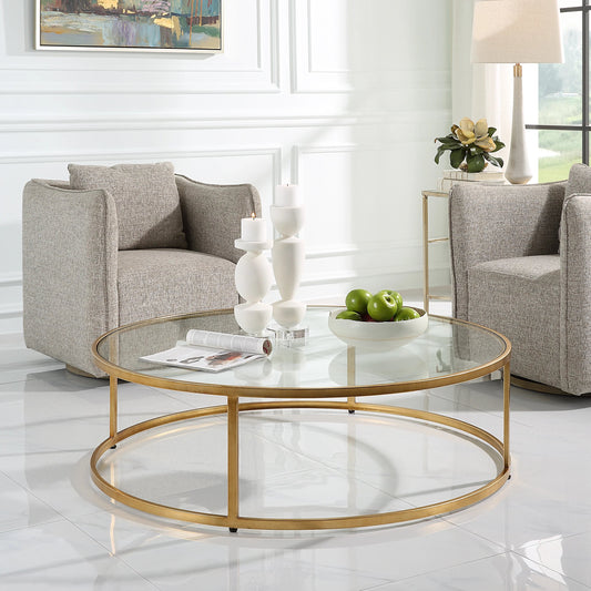 Radius Coffee Table by Uttermost in gold. Made from metal, glass in a modern style.