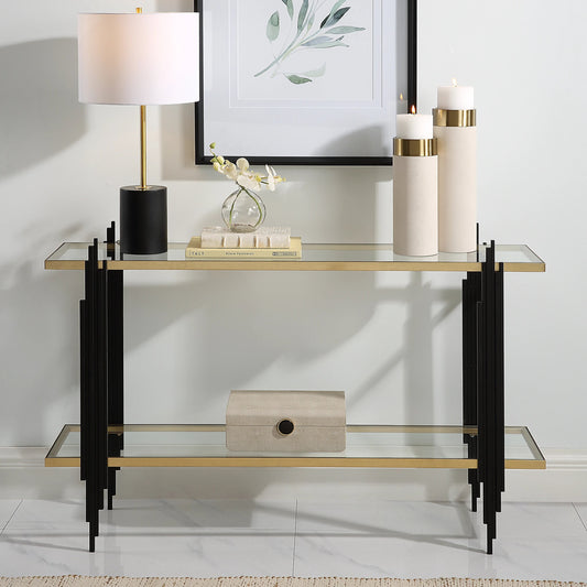 Empire Cityscape Console Table by Uttermost in gold leaf. Made from iron, tempered glass in a modern style.