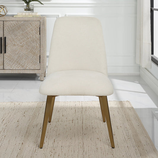 Vantage Dining Chair by Uttermost in brass. Made from stainless steel, plywood, fabric, foam in a transitional style.