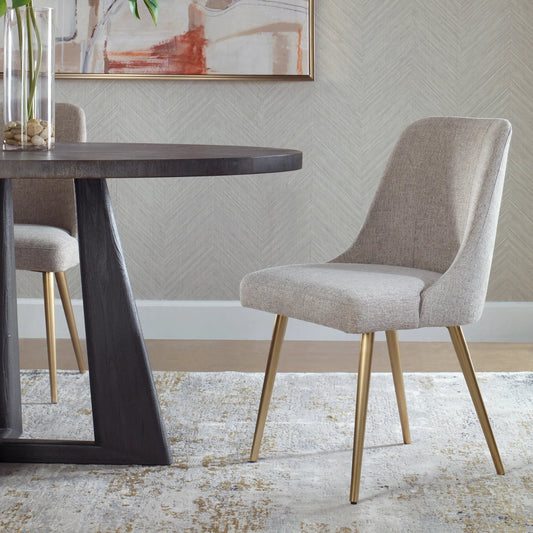 Bramwell Dining Chair by Uttermost in gold. Made from metal, plywood, foam, fabric in a transitional style.