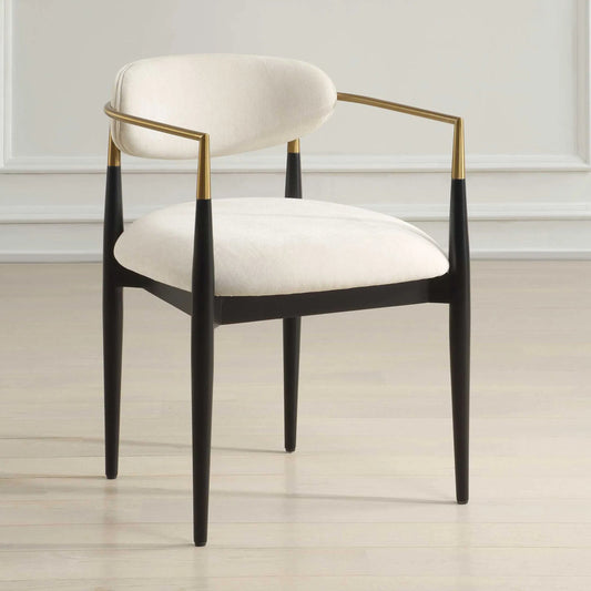 Moxie Dining Arm Chair by Uttermost in off white, brass. Made from rubber wood, foam, fabric, iron, plywood in a modern style.