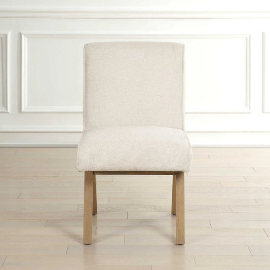 Blakely Armless Dining Chair by Uttermost in white. Made from oak solid, plywood, foam, fabric in a transitional style.