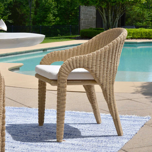 Kavali Outdoor Wicker Dining Armchair by Uttermost in white. Made from aluminium, wicker in a rustic style.