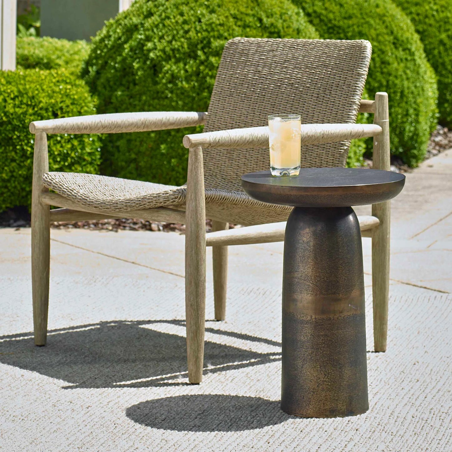 007 SI-2386824 | Lifestyle | Joppa Outdoor Accent Table by Uttermost. Made from metal in a modern style.