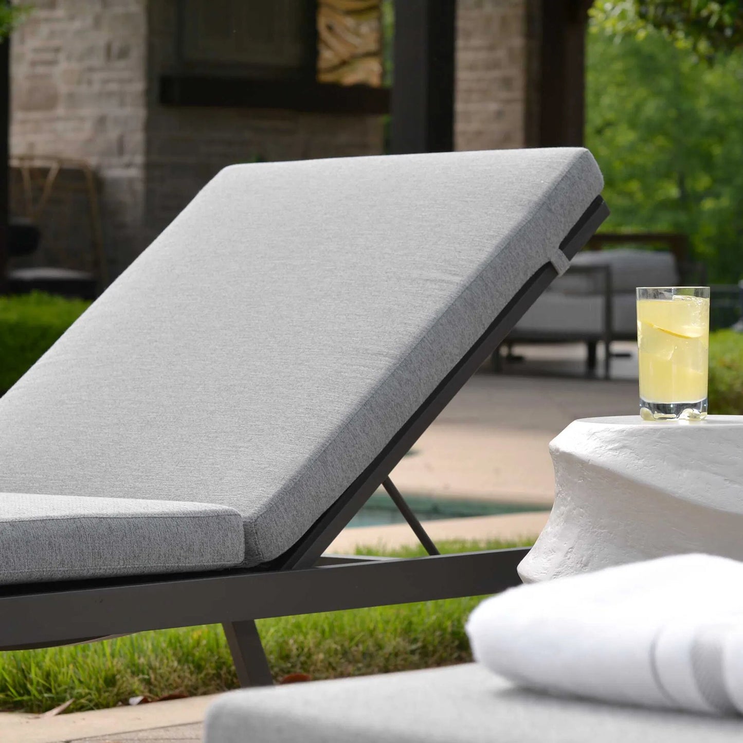 003 SI-2386859 | Lifestyle | Bea Outdoor Pool Chaise Cushion by Uttermost in gray. Made from cushion crescent shark skin in a transitional style.