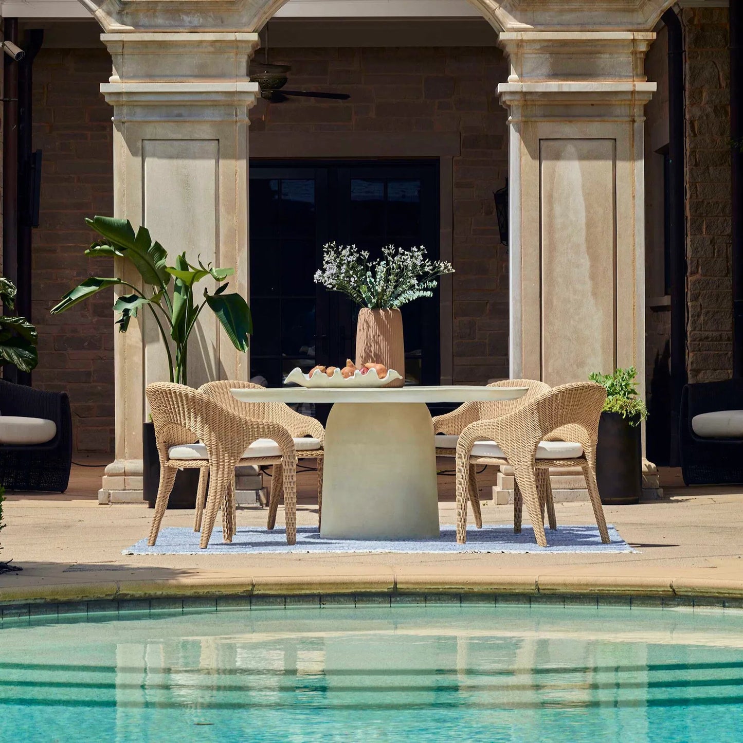 009 SI-2386833 | Lifestyle | Madrone Outdoor Dining Table by Uttermost. Made from unique in a modern style.