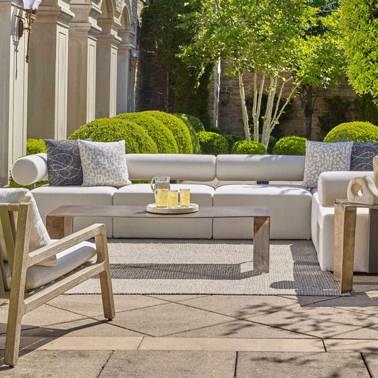Reade Outdoor Coffee Table by Uttermost in brass. Made from aluminium in a modern style.