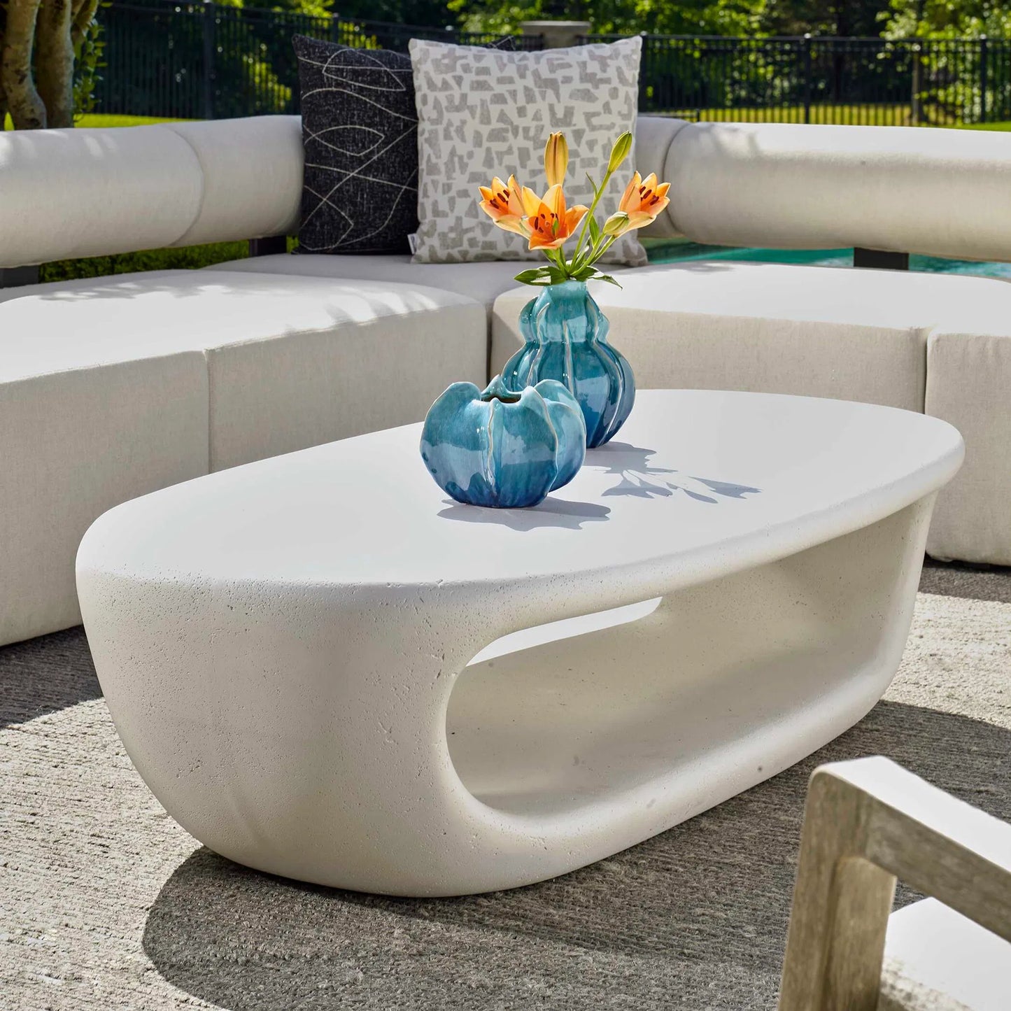 003 SI-2386805 | Lifestyle | Leyton Outdoor Coffee Table by Uttermost in white. Made from glass fiber reinforced concrete in a modern style.