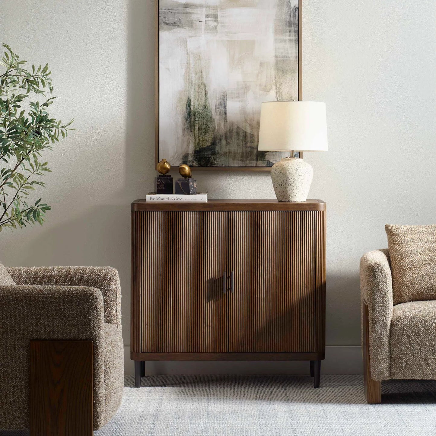 004 SI-2453131 | Lifestyle | Pinstripe Tambour 2 Door Cabinet by Uttermost in light walnut. Made from mdf mango veneer, javamix wood in a transitional style.