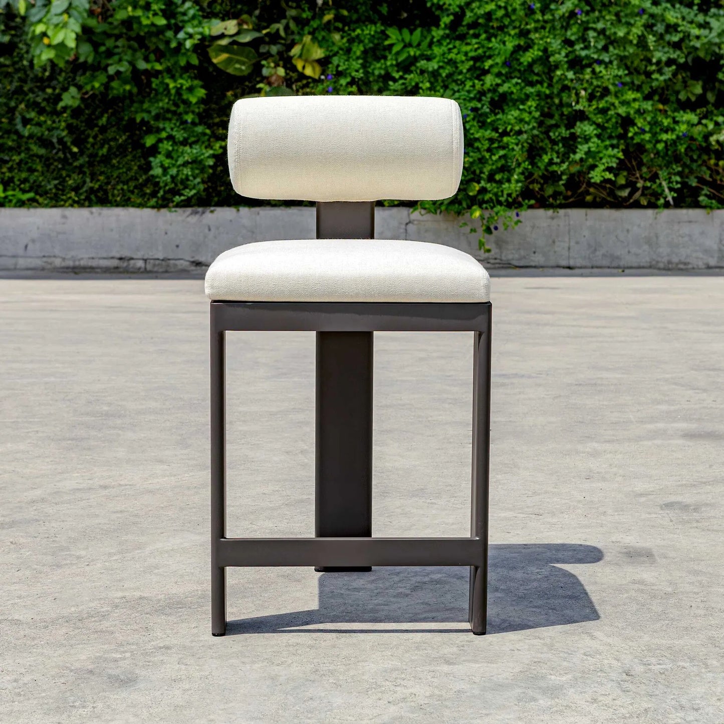 004 SI-2386866 | Lifestyle | Bolster Back Outdoor Counter Stool by Uttermost in oyster white. Made from metal aluminium with cushion crescent cloud dancer in a transitional style.