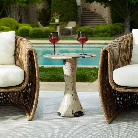 Cadas Indoor/Outdoor Side Table by Uttermost in black, white and black. Made from coral stone, black resin in a unique style.
